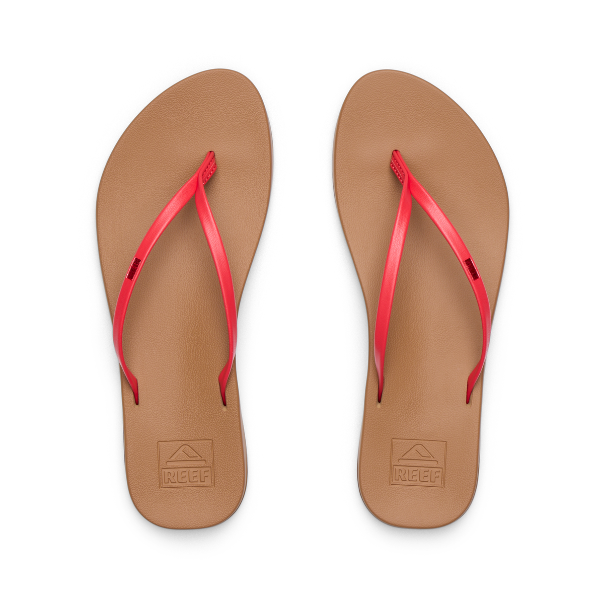 Pair of Cushion Slim women's flip-flops facing up showing tan footbed with red straps, water-friendly and comfort-focused design.
