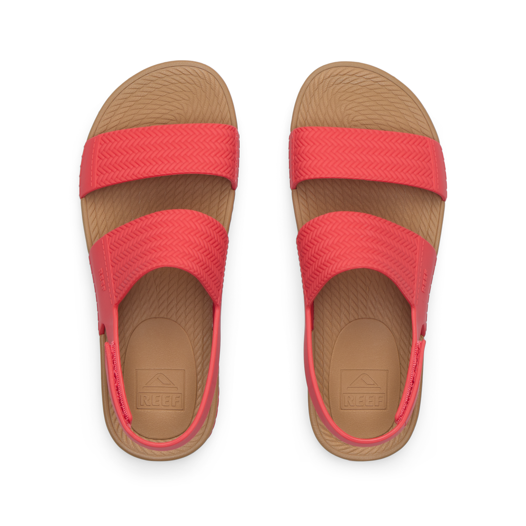 Top view of women's Reef Water Vista coral sandals with arch support and cushioned footbeds, designed for beach comfort.
