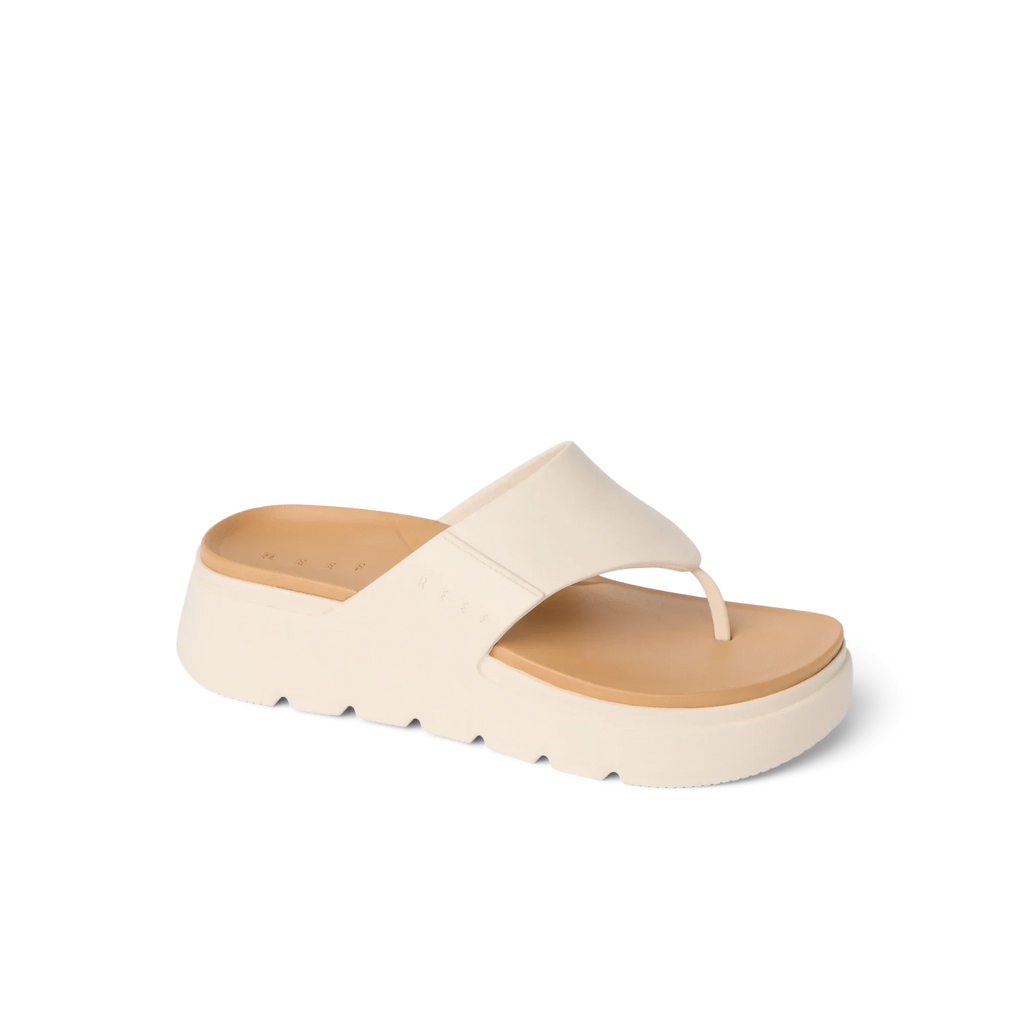 Cali Laguna sandal facing right, close-up of platform sole and cushioned toe post in white, beach-inspired comfort design