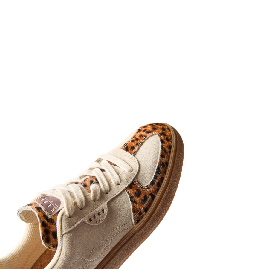 Boardwalk Callie sneaker facing left, close-up on lace area and leopard print accent, beach-inspired comfort and support.