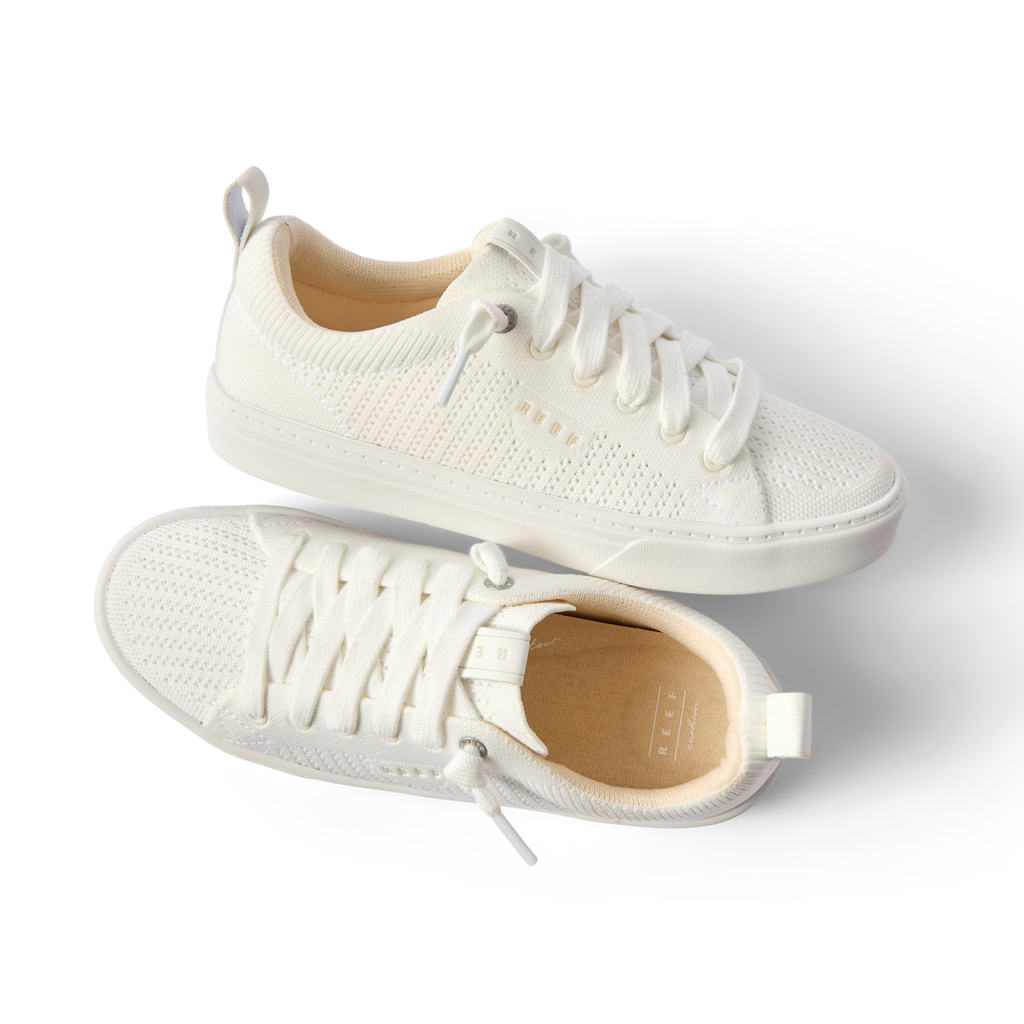 Top and side views of women's Lay Day Lite white sneakers facing right, highlighting lightweight comfort and arch support.