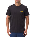 Front view of a man wearing a black Isac Tee with small yellow Reef logo, beach-inspired men's apparel for everyday comfort.