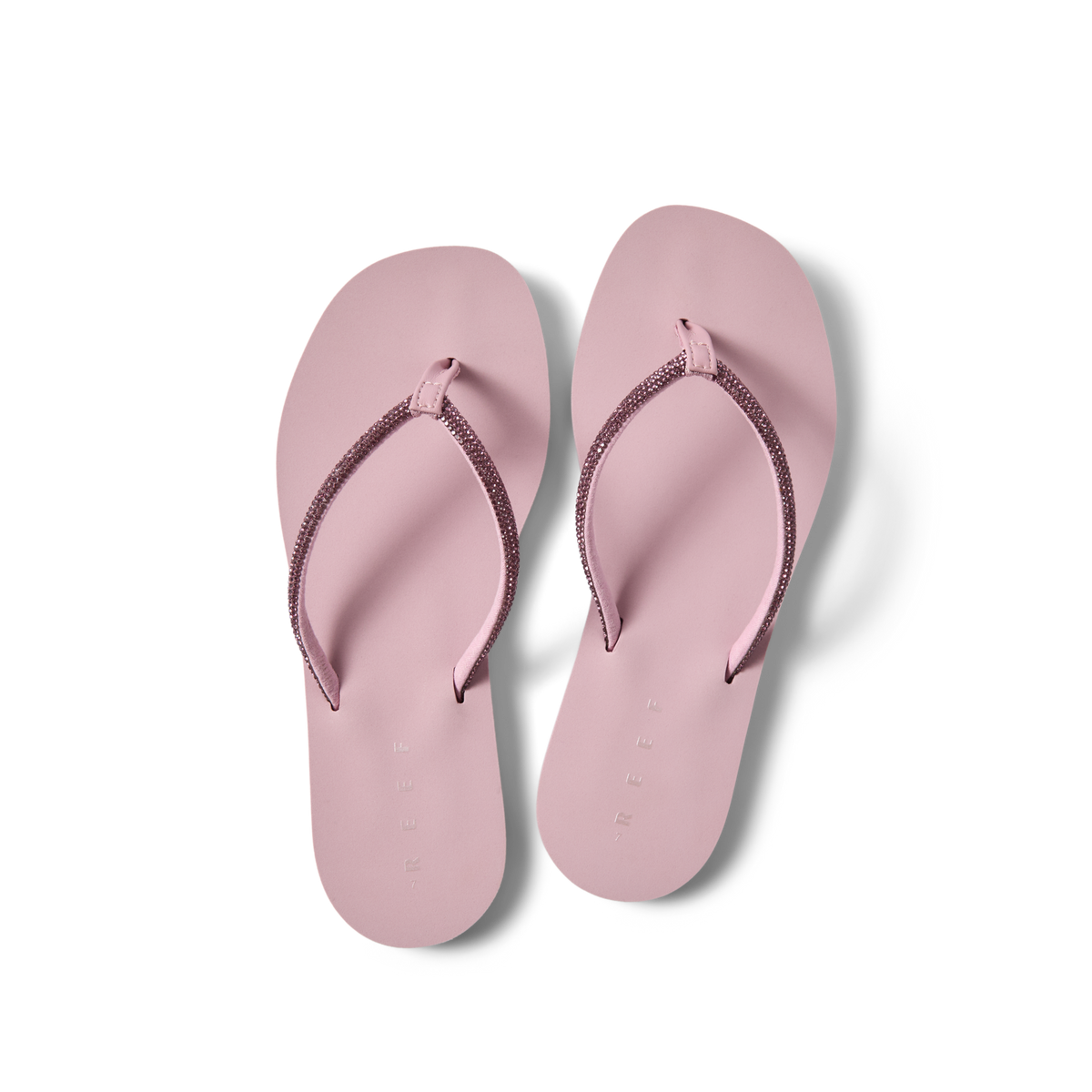 Bliss Bling Fling women's pink flip flops top view, facing upward, with soft-rebound cushioning and arch support for beach comfort.