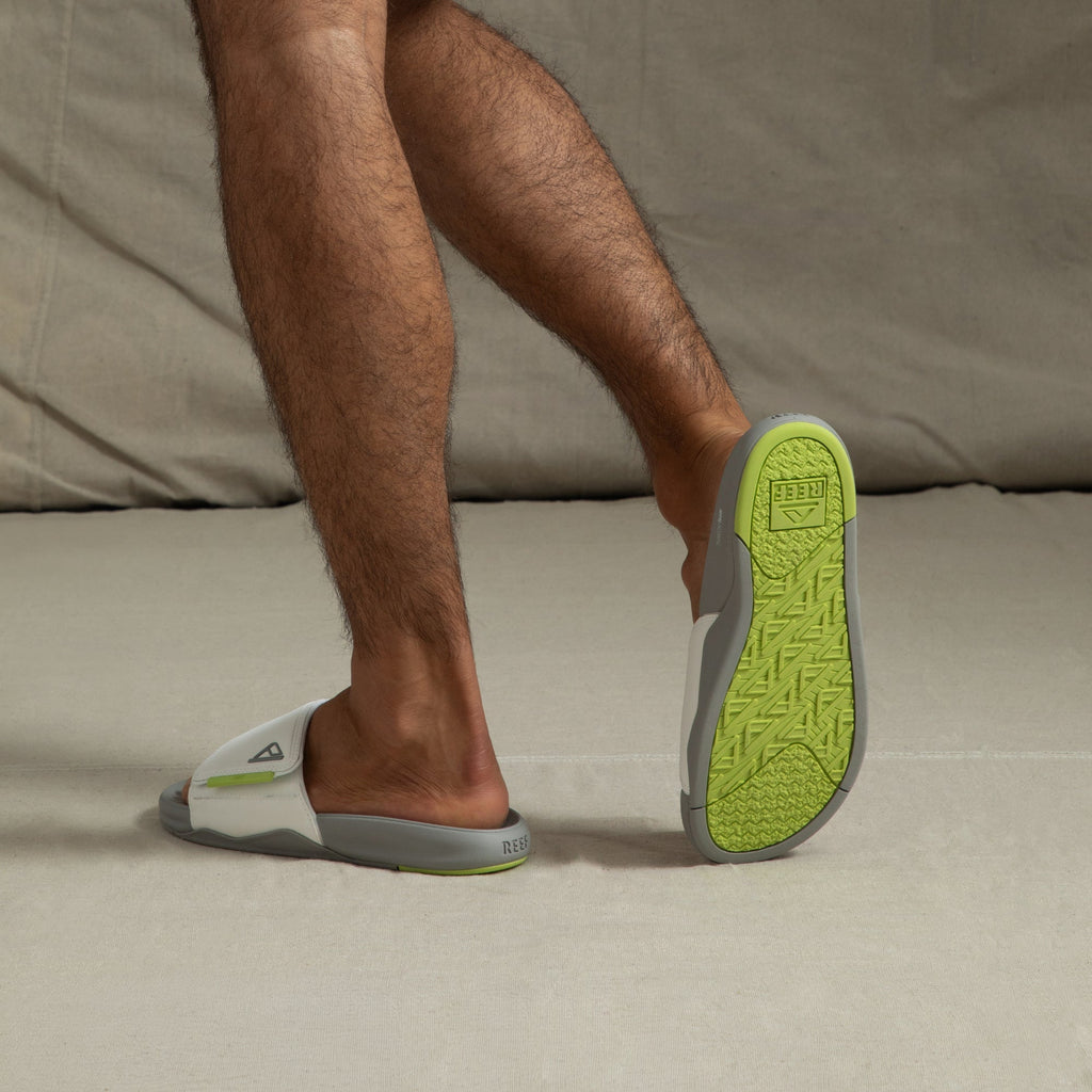 Phantom Slab men's slides facing backward showing lime green outsole with arch support and extra cushioning.