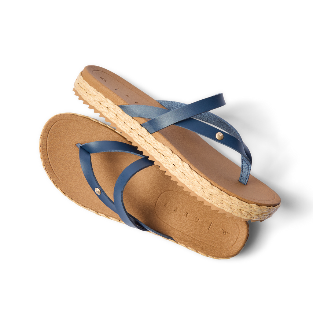 Vista Carmen women's sandals in navy and tan facing left, featuring soft-rebound cushioning and anatomical arch support.