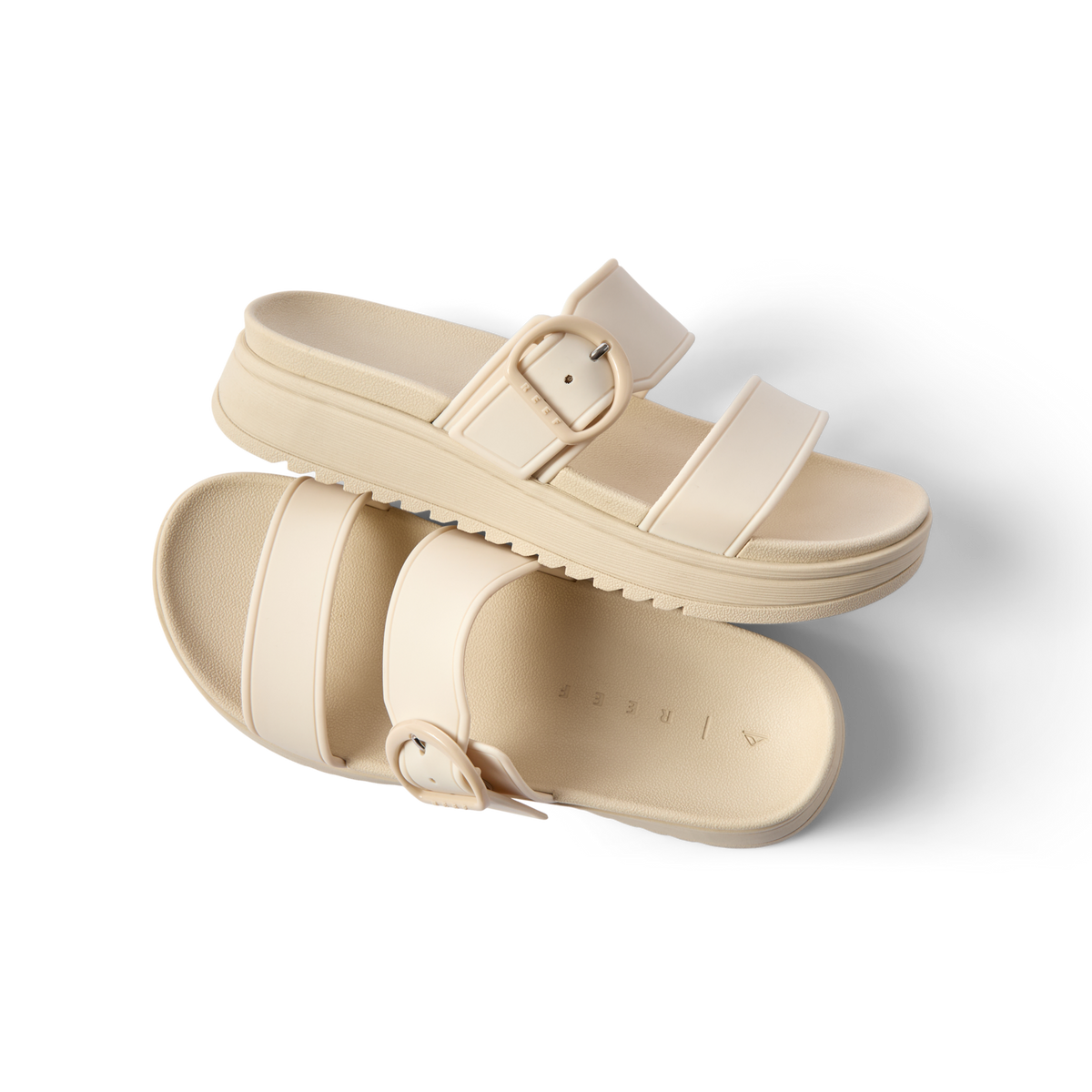 Vista Capri women's sandals in beige facing right and left, featuring adjustable buckle and cushioned footbed for beach comfort.