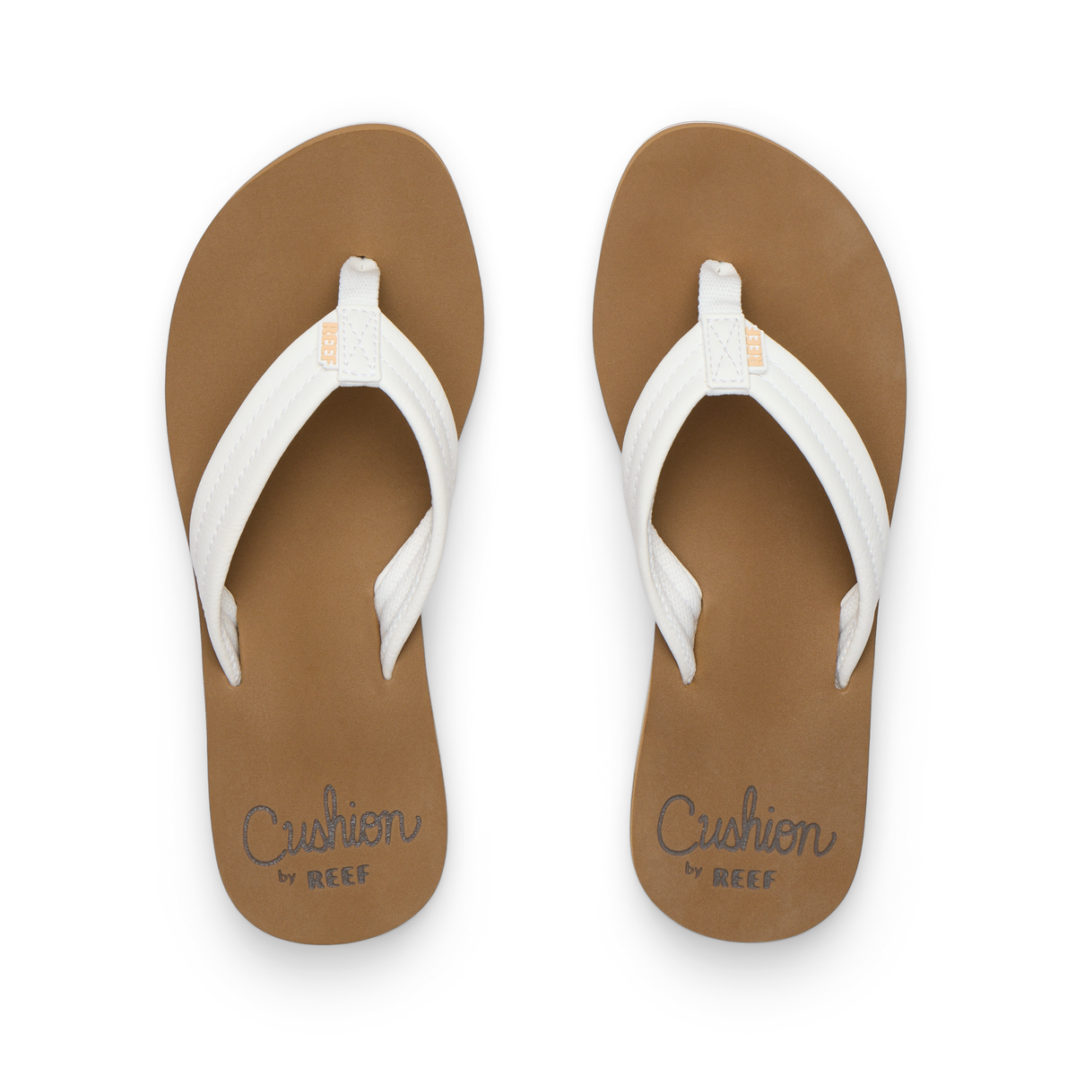 Top view of Reef Cushion Breeze white and brown women's flip flop sandals with cushioned footbed for comfort and arch support.