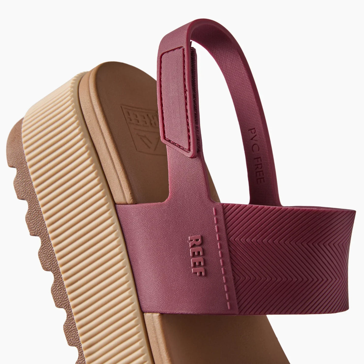 Water Vista Higher sandal facing left, close-up of maroon strap and beige cushioned arch support sole with REEF branding.