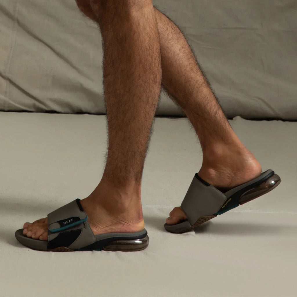 Pair of Fanning + Slide sandals facing left, brown and grey water-friendly men's slides with oversized airbag heel and arch support.