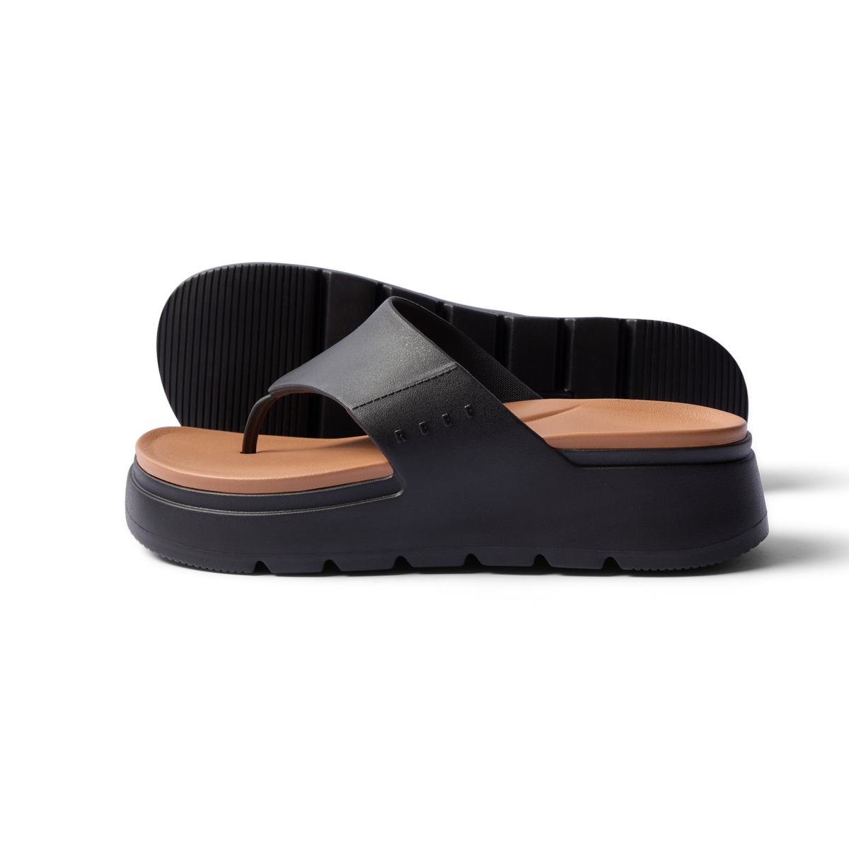 Cali Laguna platform sandal facing right with black straps and cushioned tan footbed, water-friendly and comfort focused