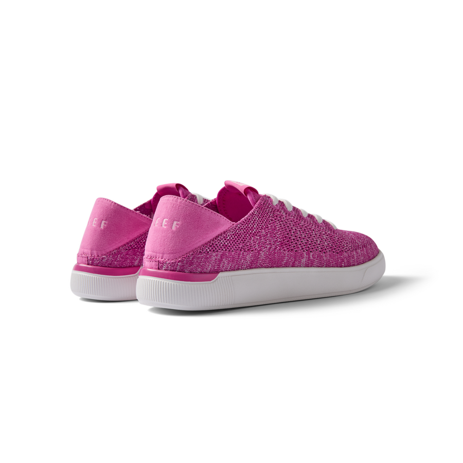 Kids Neptune pink sneakers angled rear view showing heel and side with REEF branding, lightweight and comfortable design.