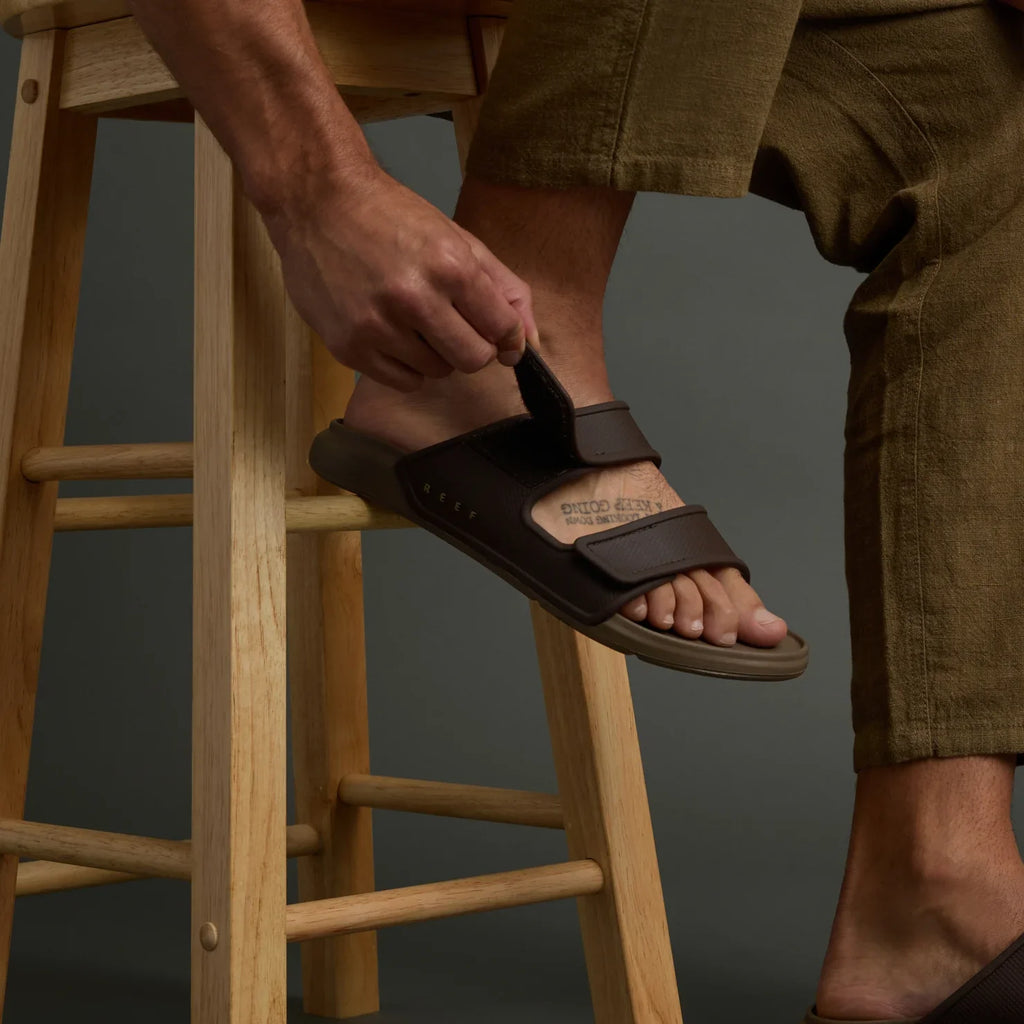 Oasis Adapt men's brown sandal facing left, close-up of upper straps with adjustable hook and loop closure.