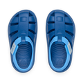 Top view of Little Totally Beachin sandals for boys, blue waterproof shoes with arch support and cushioned footbed.