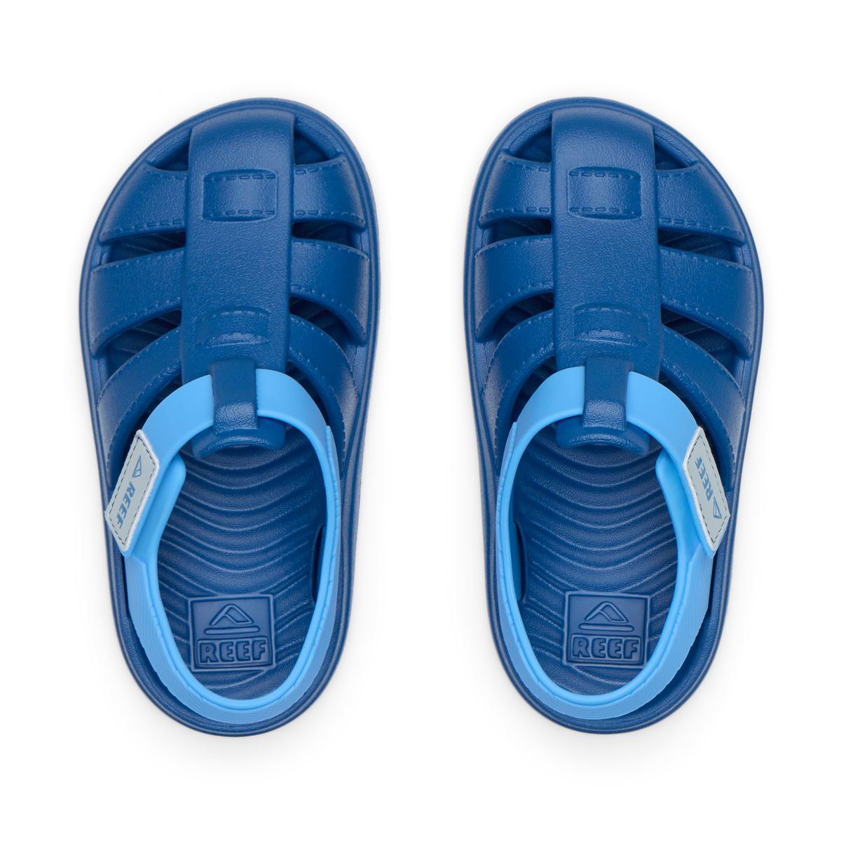 Top view of Little Totally Beachin sandals for boys, blue waterproof shoes with arch support and cushioned footbed.