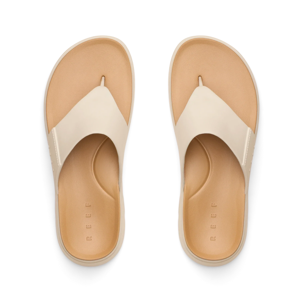 Top view of Cali Laguna white platform sandals facing upward, featuring extra cushioning and arch support, water-friendly design.