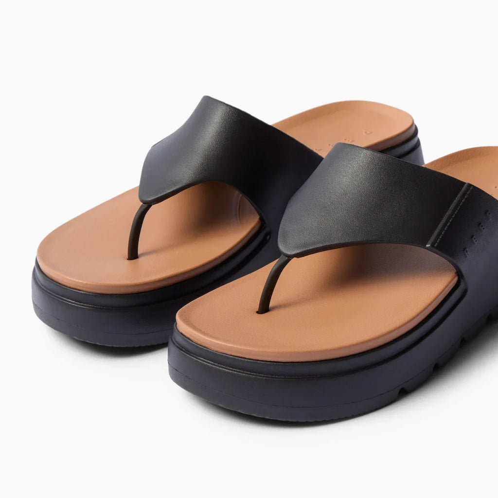 Cali Laguna black platform sandals facing left with molded brown footbed, water-friendly cushioned comfort for everyday wear