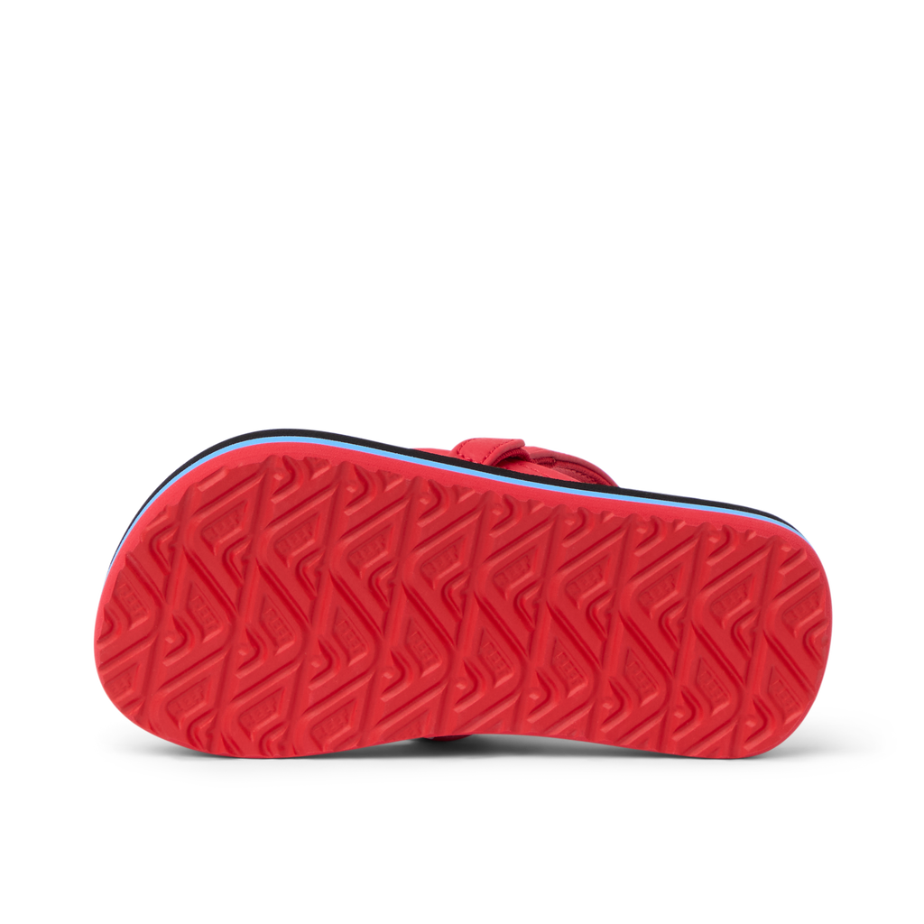 Little Ahi boys sandal sole facing up, showing durable, water-friendly textured outsole with arch support.
