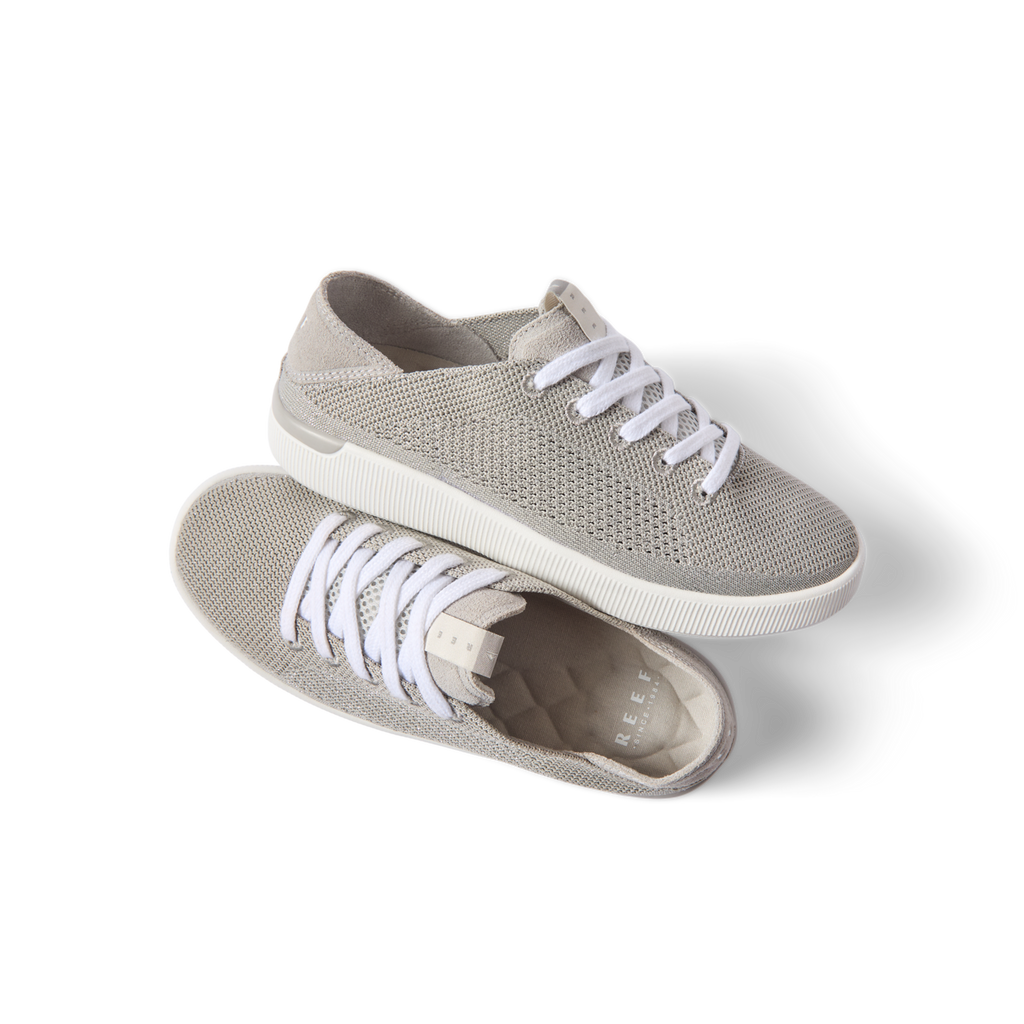 Reef Neptune lightweight women's sneakers in neutral breathable knit, left shoe facing right, right shoe top view showing cushioned insole.