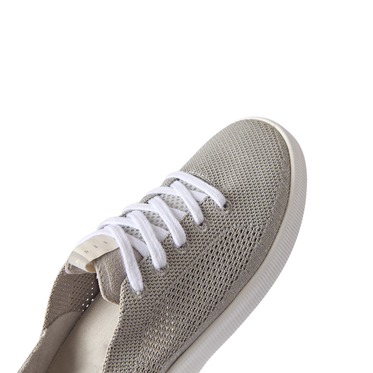 Reef Neptune women's sneaker facing forward, showing breathable knit upper with soft cushioning for beach comfort.