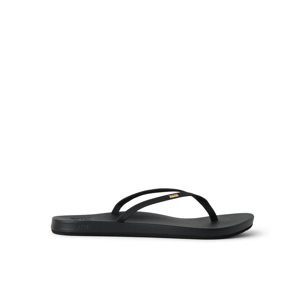 Cushion Slim black flip flop facing left, showing side profile with anatomical arch support and soft cushioning.