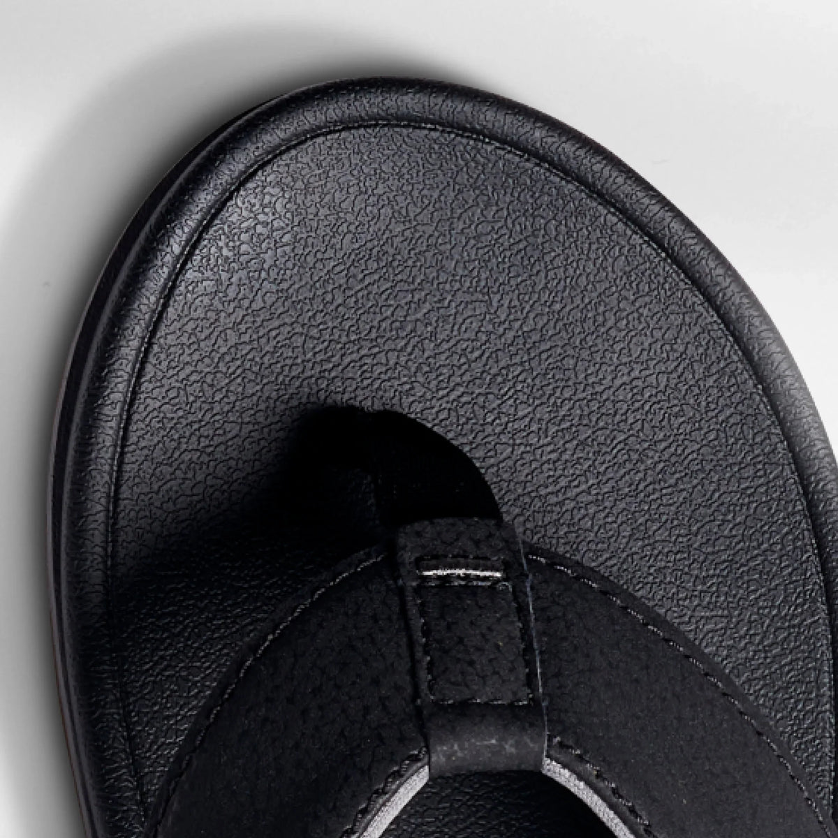 Close-up of the front toe area of the Phantom Bonzer men's black sandal, designed for beach comfort and durability.