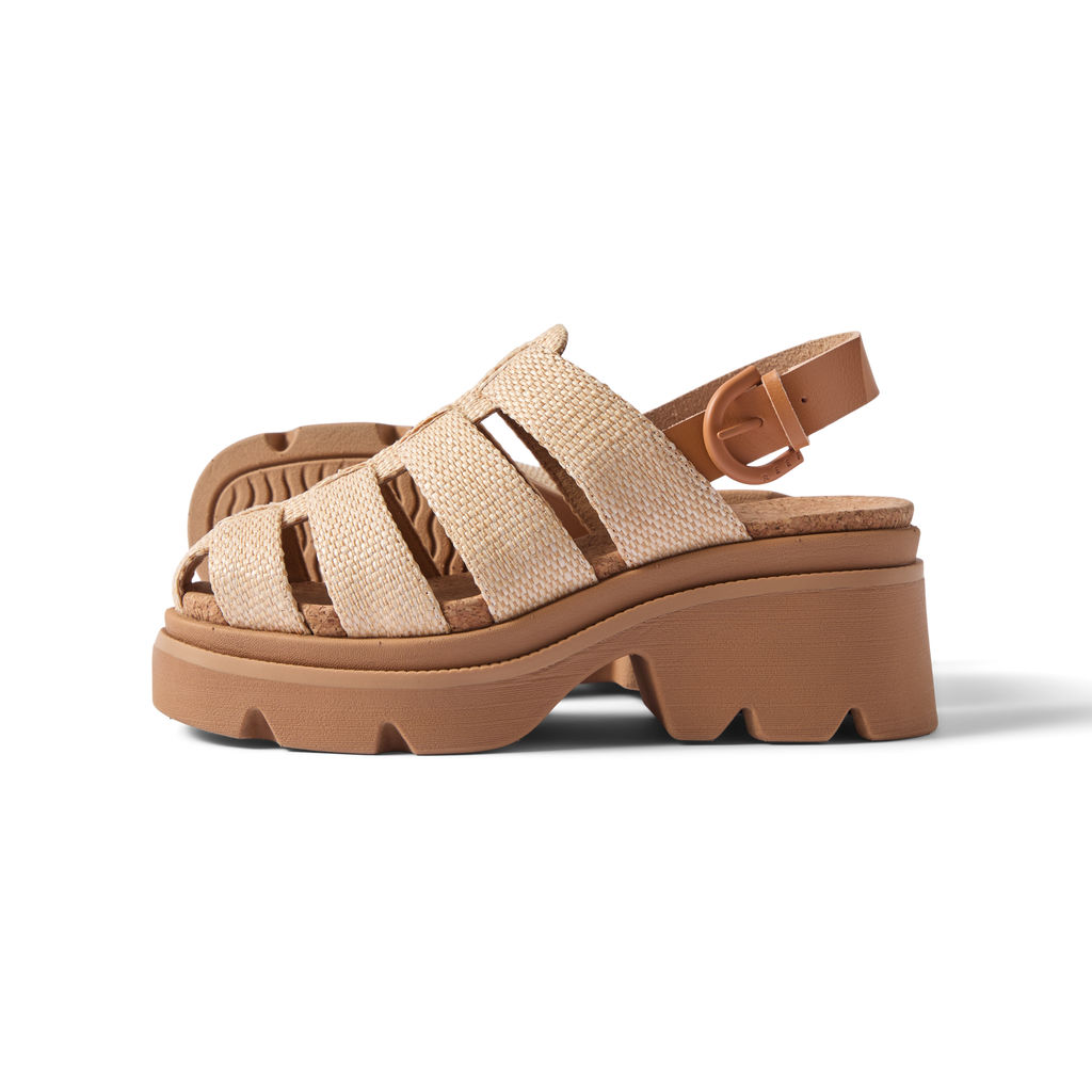 Vista Luxe Lucie women's sandal facing left, raffia straps, cushioned sole, platform heel, beach-inspired comfort design.