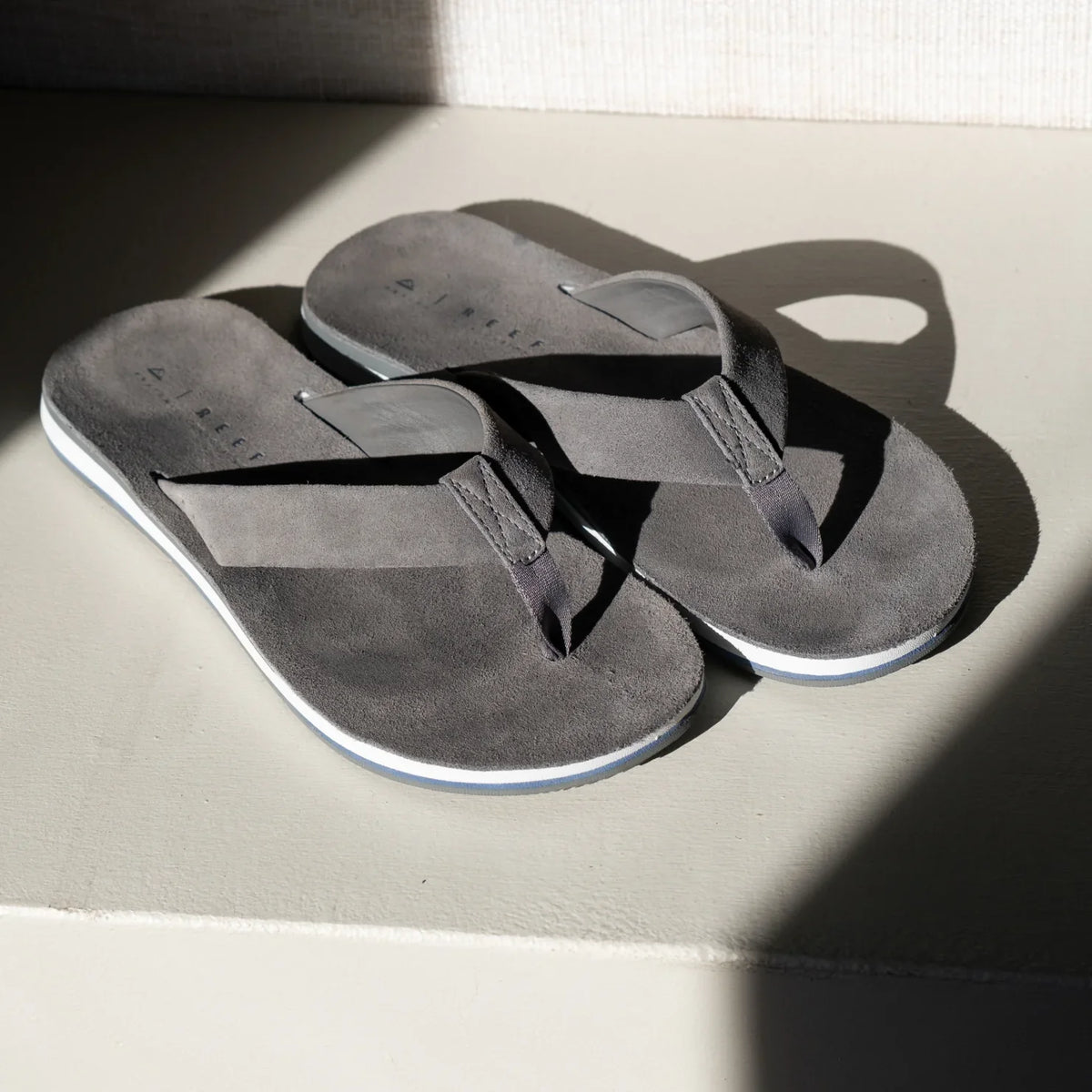 Ojai Classic men's grey flip flops facing upward showing top straps and soft-rebound cushioned footbed for comfort.