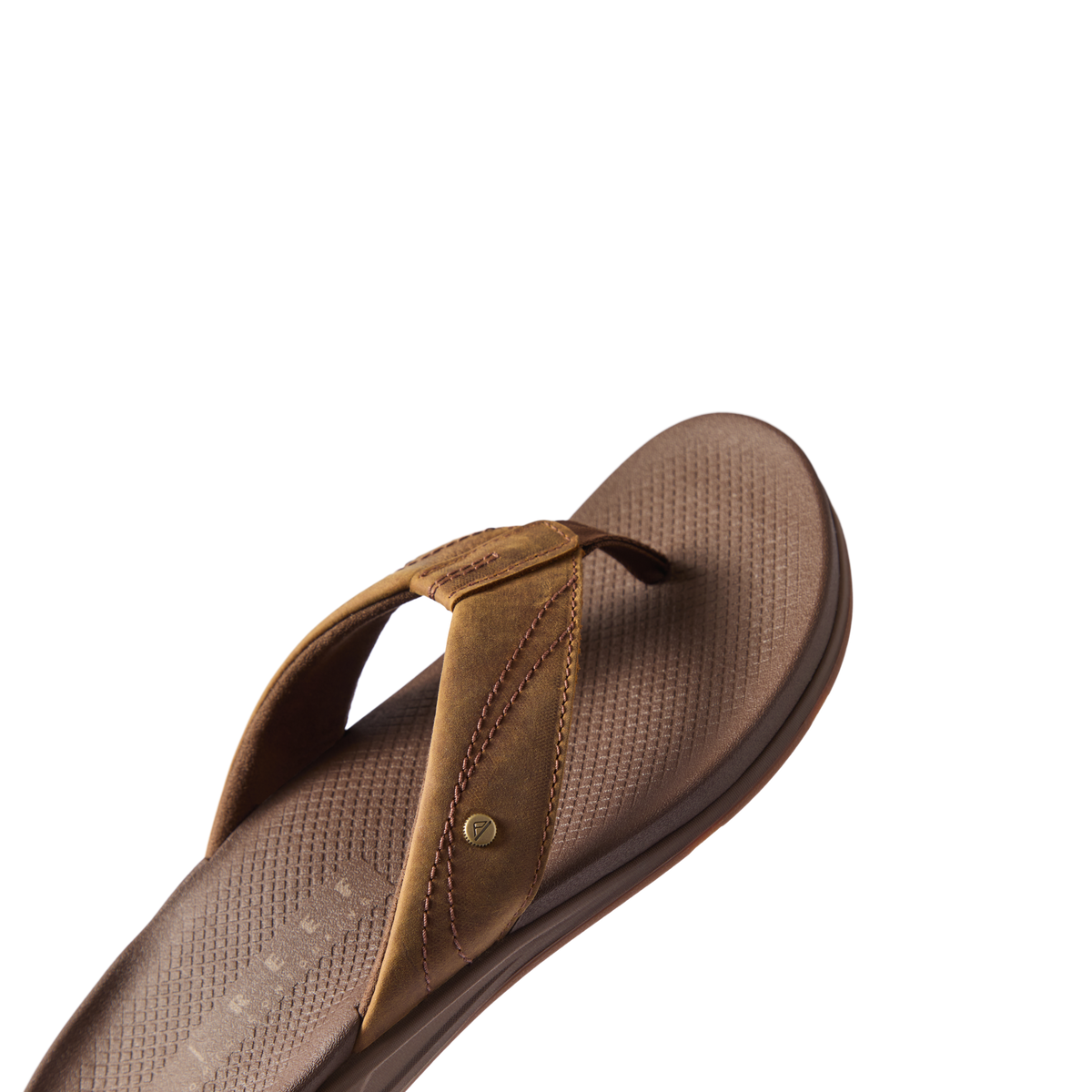 Phantom Lux men's sandal facing right, close-up of cushioned footbed and soft toffee brown straps for beach comfort.