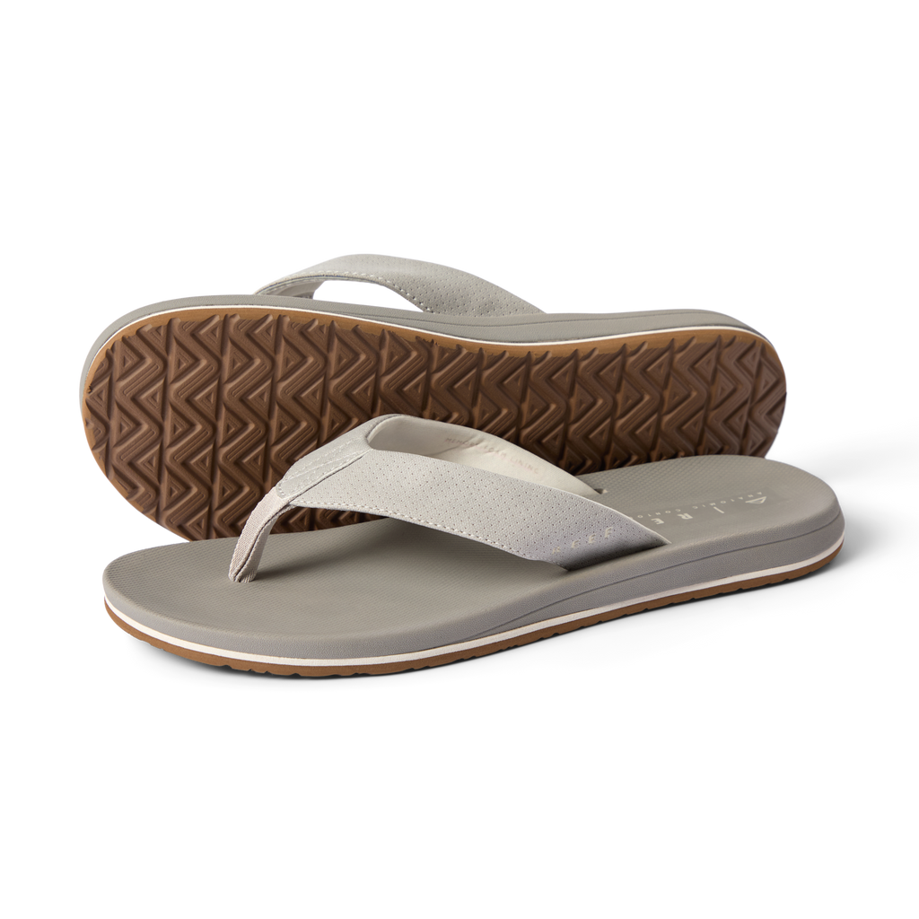 Nox men's grey flip flop sandals, angled front and bottom views, showcasing cushioned sole and textured tread.