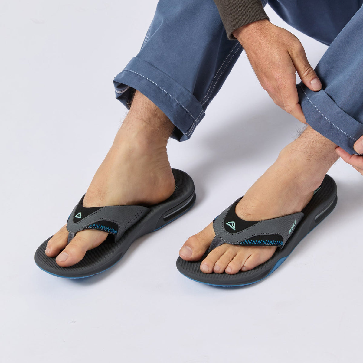 Fanning men's surf-inspired sandals facing forward, showing top and side with cushioned straps and arch support.